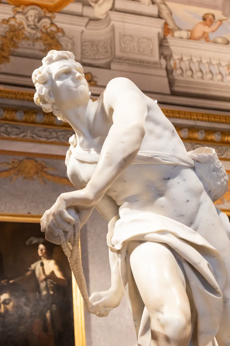 Bernini's marble David, sling drawn back, in Room II of the Borghese Gallery