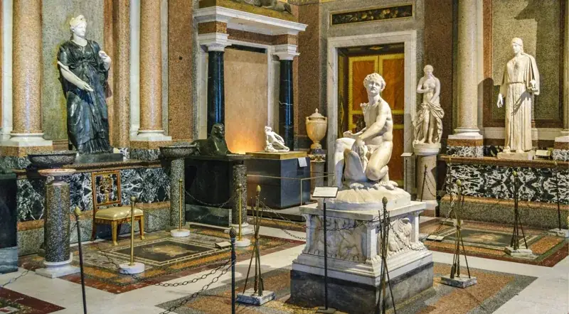 Sculpture room inside the Borghese Gallery with Bernini-era marbles and inlaid floors