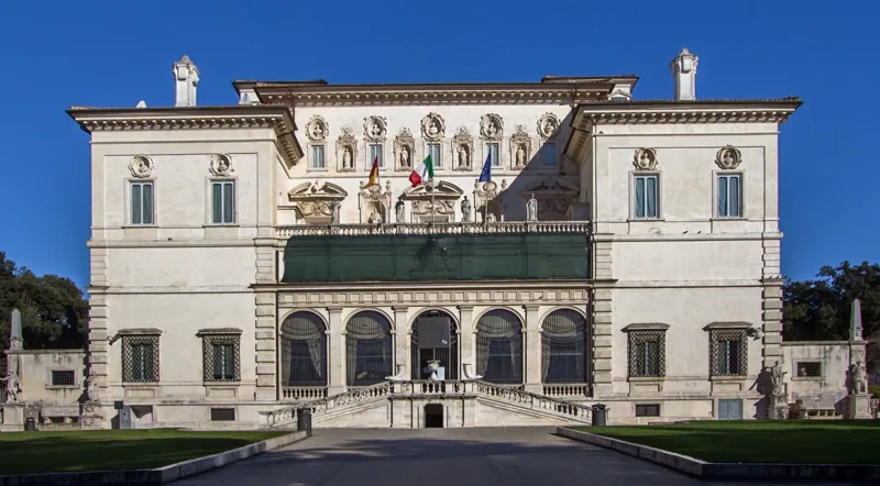 Galleria Borghese front facade with Italian and EU flags above the entrance loggia
